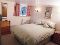 Main Bedroom at the Coach House at kerridge End Holiday Cottages